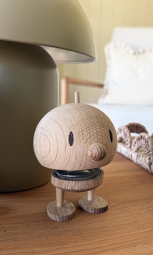 A wooden ornament sitting on a coffee table
